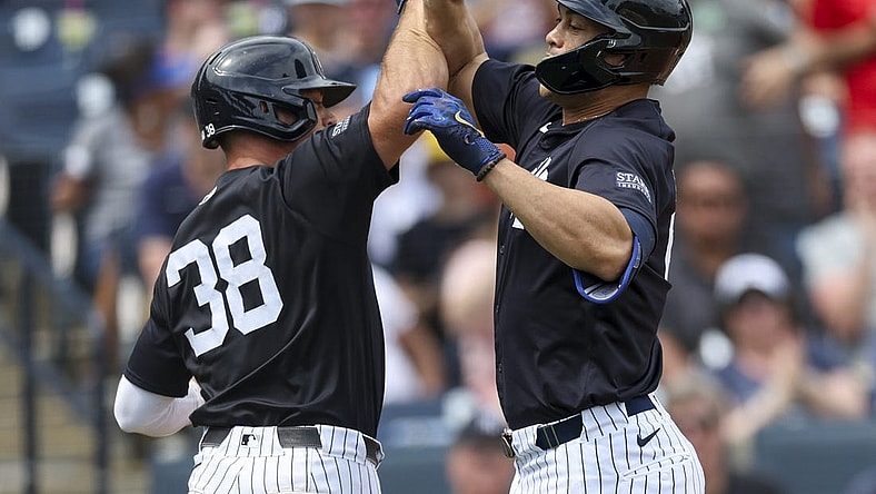 Mar 16, 2024; Tampa, Florida, USA;  New York Yankees right fielder Giancarlo Stanton (27) is congratulated by catcher Ben Rorvedt (38) after hitting a two run home run at George M. Steinbrenner Field. Mandatory Credit: Nathan Ray Seebeck-USA TODAY Sports