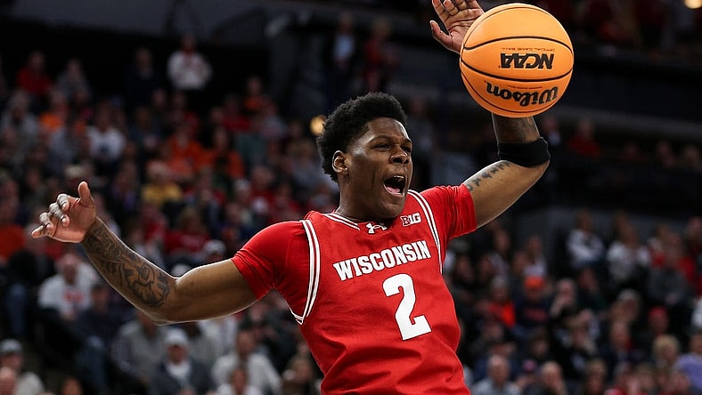 Mar 16, 2024; Minneapolis, MN, USA; Wisconsin Badgers guard AJ Storr (2) celebrates his dunk against the Purdue Boilermakers during the overtime at Target Center. Mandatory Credit: Matt Krohn-USA TODAY Sports
