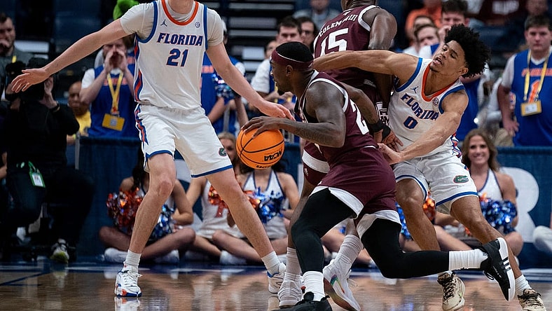 Texas A&M Aggies forward Henry Coleman III (15) sets a pick on Florida Gators guard Zyon Pullin (0) to free up Texas A&M Aggies guard Tyrece Radford (23) during their SEC Men's Basketball Tournament semifinal game at Bridgestone Arena in Nashville, Tenn., Saturday, March 16, 202 at Bridgestone Arena in Nashville, Tenn., Saturday, March 16, 2024.