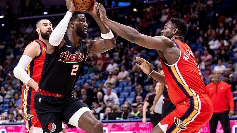 Mar 16, 2024; New Orleans, Louisiana, USA; Portland Trail Blazers center Deandre Ayton (2) dribbles against New Orleans Pelicans forward Zion Williamson (1) during the first half at Smoothie King Center. Mandatory Credit: Stephen Lew-USA TODAY Sports