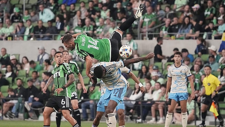 Mar 16, 2024; Austin, Texas, USA; Austin FC forward Diego Rubio (14) and Philadelphia Union defender Damion Lowe (17) collide in the first half at Q2 Stadium. Mandatory Credit: Scott Wachter-USA TODAY Sports