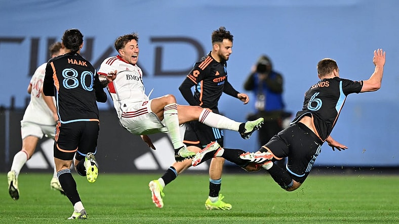 Mar 16, 2024; New York, New York, USA; Toronto FC forward Federico Bernardeschi (10) and New York City FC midfielder James Sands (6) collide during the second half at Yankee Stadium. Mandatory Credit: Mark Smith-USA TODAY Sports