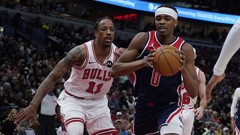 Mar 16, 2024; Chicago, Illinois, USA; Chicago Bulls forward DeMar DeRozan (11) defends Washington Wizards guard Bilal Coulibaly (0) during the second half at United Center. Mandatory Credit: David Banks-USA TODAY Sports