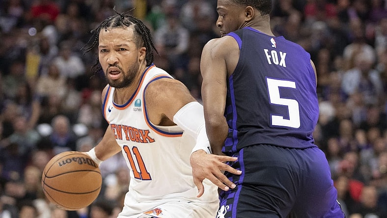 March 16, 2024; Sacramento, California, USA; New York Knicks guard Jalen Brunson (11) dribbles the basketball against Sacramento Kings guard De'Aaron Fox (5) during the second quarter at Golden 1 Center. Mandatory Credit: Kyle Terada-USA TODAY Sports