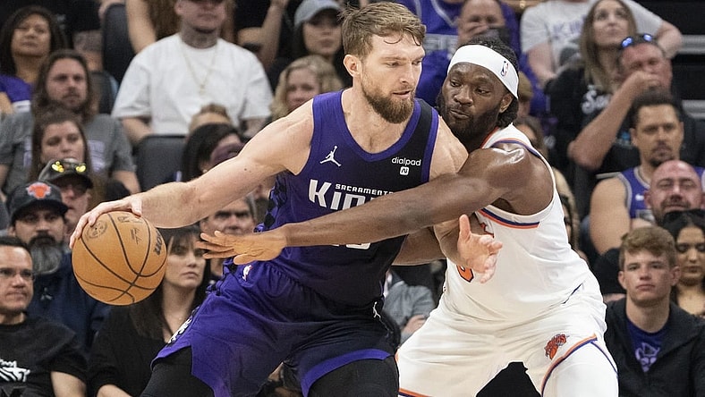 March 16, 2024; Sacramento, California, USA; Sacramento Kings forward Domantas Sabonis (10) dribbles the basketball against New York Knicks forward Precious Achiuwa (5) during the second quarter at Golden 1 Center. Mandatory Credit: Kyle Terada-USA TODAY Sports