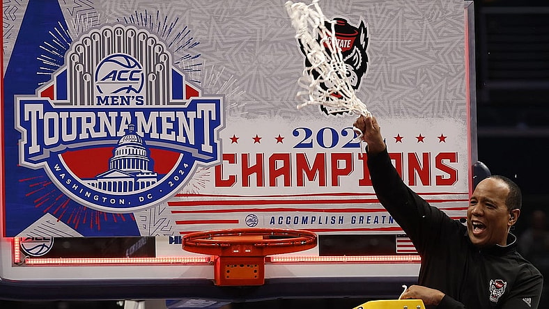 Mar 16, 2024; Washington, D.C., USA; North Carolina State Wolfpack head coach Kevin Keatts reacts by cutting the net from the basketball rim after defeating the North Carolina Tar Heels at Capital One Arena. Mandatory Credit: Geoff Burke-USA TODAY Sports