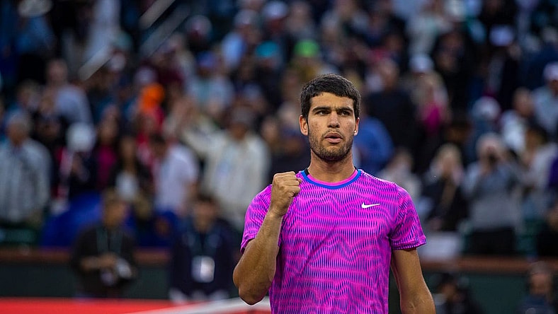 Carlos Alcaraz celebrates his match win over Jannik Sinner during the ATP semifinals of the BNP Paribas Open in Indian Wells, Calif., Saturday, March 16, 2024.