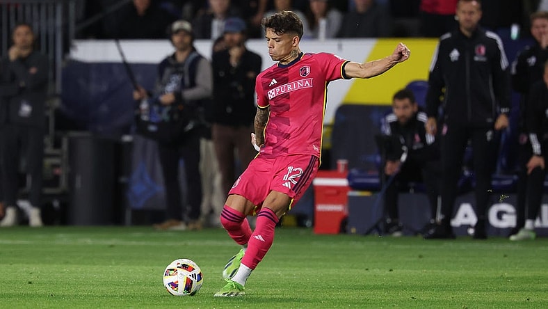 Mar 17, 2024; Carson, California, USA; St. Louis CITY SC midfielder Celio Pompeu (12) takes a free-kick against the LA Galaxy during the second half at Dignity Health Sports Park. Mandatory Credit: Kiyoshi Mio-USA TODAY Sports