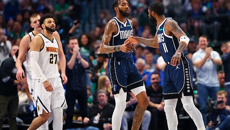 Mar 17, 2024; Dallas, Texas, USA;  Dallas Mavericks forward Derrick Jones Jr. (55) celebrates with Dallas Mavericks guard Kyrie Irving (11) in front of Denver Nuggets guard Jamal Murray (27) during the first quarter at American Airlines Center. Mandatory Credit: Kevin Jairaj-USA TODAY Sports