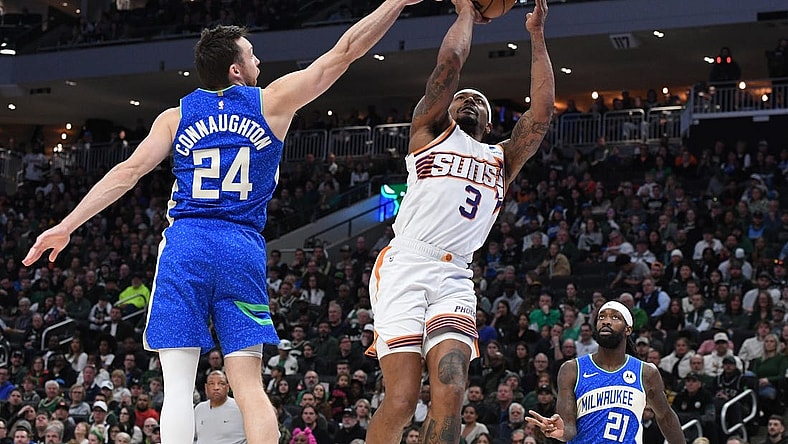 Mar 17, 2024; Milwaukee, Wisconsin, USA; Phoenix Suns guard Bradley Beal (3) drives to the basket against Milwaukee Bucks guard Pat Connaughton (24) in the second half at Fiserv Forum. Mandatory Credit: Michael McLoone-USA TODAY Sports
