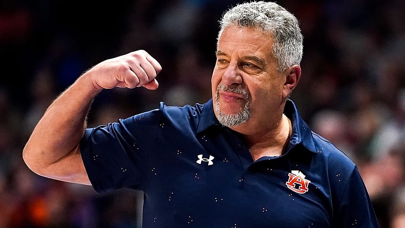 Auburn head coach Bruce Pearl celebrates during the second half of the SEC tournament championship game against Florida at Bridgestone Arena in Nashville, Tenn., Sunday, March 17, 2024.