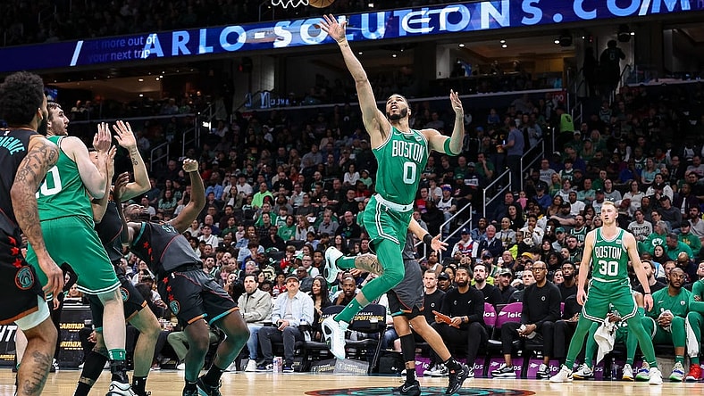 Mar 17, 2024; Washington, District of Columbia, USA; Boston Celtics forward Jayson Tatum (0) goes to the basket against the Washington Wizards during the first half of the game at Capital One Arena. Mandatory Credit: Scott Taetsch-USA TODAY Sports