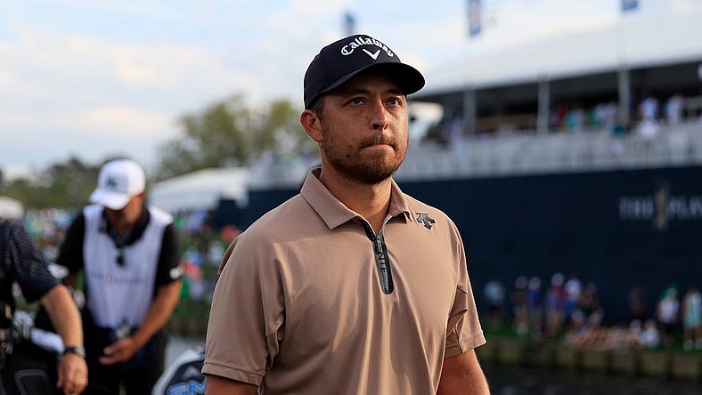 Xander Schauffele walks off hole 18 during the fourth and final round of The Players Championship PGA golf tournament Sunday, March 17, 2024 at TPC Sawgrass in Ponte Vedra Beach, Fla. Scottie Scheffler won at 20 under par and is the first defending champion in the 50 year history of the event. [Corey Perrine/Florida Times-Union]