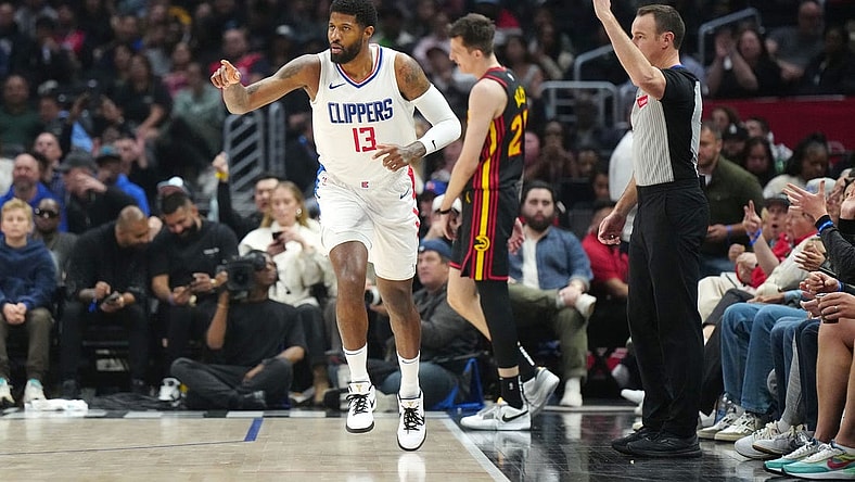 Mar 17, 2024; Los Angeles, California, USA; LA Clippers forward Paul George (13) gestures after a three-point basket against the Atlanta Hawks in the second half at Crypto.com Arena. Mandatory Credit: Kirby Lee-USA TODAY Sports