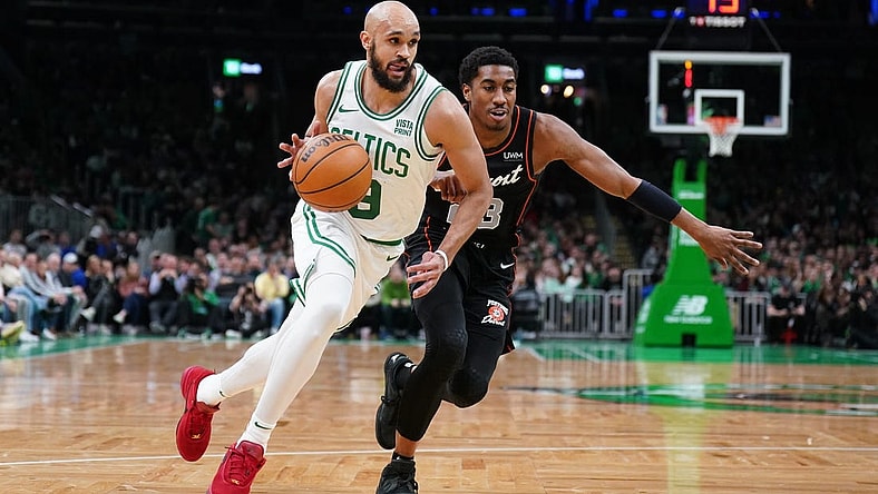 Mar 18, 2024; Boston, Massachusetts, USA; Boston Celtics guard Derrick White (9) drives the ball against Detroit Pistons guard Jaden Ivey (23) in the first quarter at TD Garden. Mandatory Credit: David Butler II-USA TODAY Sports