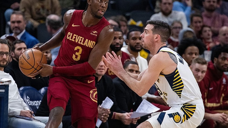 Mar 18, 2024; Indianapolis, Indiana, USA; Cleveland Cavaliers guard Caris LeVert (3) holds the ball while Indiana Pacers guard T.J. McConnell (9) defends in the first half at Gainbridge Fieldhouse. Mandatory Credit: Trevor Ruszkowski-USA TODAY Sports