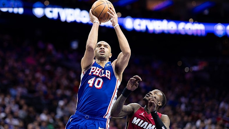 Mar 18, 2024; Philadelphia, Pennsylvania, USA; Philadelphia 76ers forward Nicolas Batum (40) drives for a shot agains Miami Heat guard Terry Rozier (2) during the second quarter at Wells Fargo Center. Mandatory Credit: Bill Streicher-USA TODAY Sports