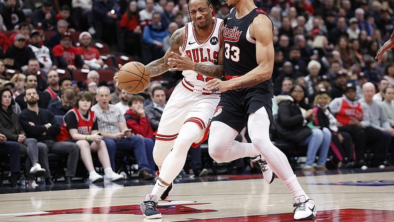 Mar 18, 2024; Chicago, Illinois, USA; Chicago Bulls forward DeMar DeRozan (11) drives to the basket against Portland Trail Blazers forward Toumani Camara (33) during the first half at United Center. Mandatory Credit: Kamil Krzaczynski-USA TODAY Sports