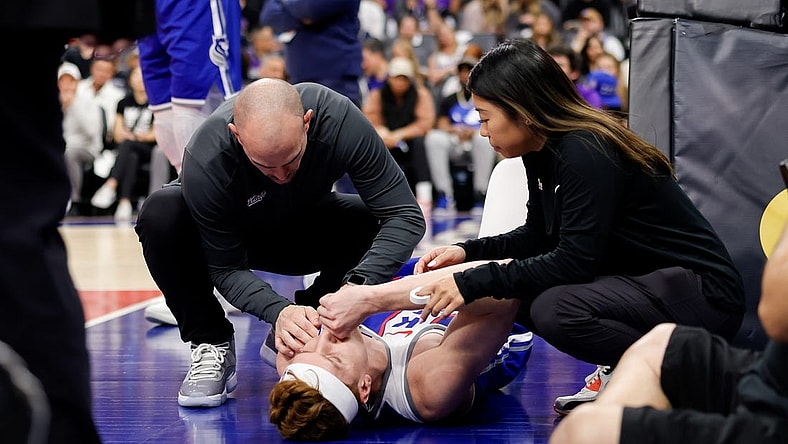 Mar 18, 2024; Sacramento, California, USA; Sacramento Kings guard Kevin Huerter (9) suffers an injury during the first quarter against the Memphis Grizzlies at Golden 1 Center. Mandatory Credit: Sergio Estrada-USA TODAY Sports