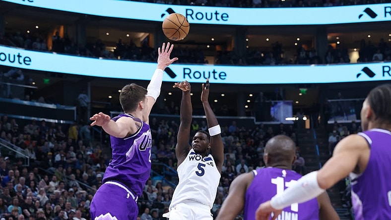 Mar 18, 2024; Salt Lake City, Utah, USA; Minnesota Timberwolves guard Anthony Edwards (5) shoots over Utah Jazz center Walker Kessler (24) during the fourth quarter at Delta Center. Mandatory Credit: Rob Gray-USA TODAY Sports
