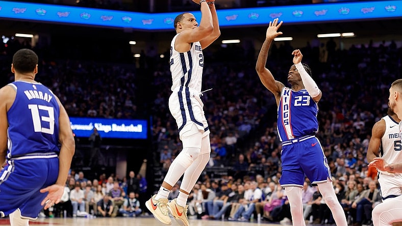 Mar 18, 2024; Sacramento, California, USA; Memphis Grizzlies guard Desmond Bane (22) shoots the ball against Sacramento Kings guard Keon Ellis (23) during the fourth quarter  at Golden 1 Center. Mandatory Credit: Sergio Estrada-USA TODAY Sports