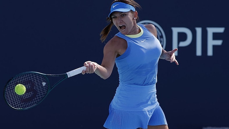 Mar 19, 2024; Miami Gardens, FL, USA; Simona Halep (ROU) hits a forehand against Paula Badosa (ESP) (not pictured) on day two of the Miami Open at Hard Rock Stadium. Mandatory Credit: Geoff Burke-USA TODAY Sports
