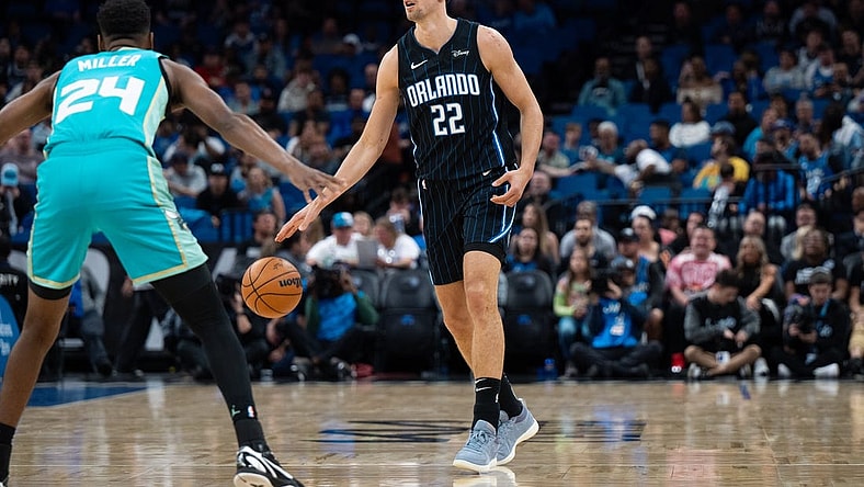 Mar 19, 2024; Orlando, Florida, USA; Orlando Magic forward Franz Wagner (22) dribbles the ball against Charlotte Hornets forward Brandon Miller (24) in the first quarter at KIA Center. Mandatory Credit: Jeremy Reper-USA TODAY Sports