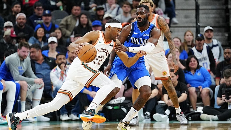 Mar 19, 2024; San Antonio, Texas, USA;  San Antonio Spurs guard Malaki Branham (22) dribbles against Dallas Mavericks forward Tim Hardaway Jr. (10) in the second half at Frost Bank Center. Mandatory Credit: Daniel Dunn-USA TODAY Sports