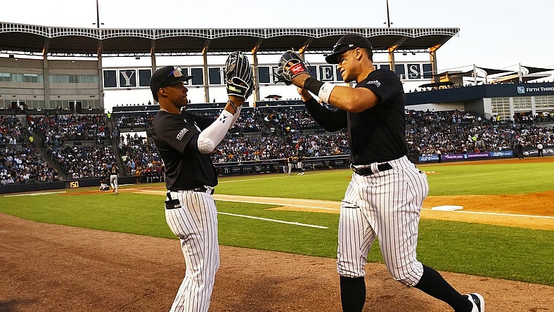 Mar 20, 2024; Tampa, Florida, USA; New York Yankees left fielder Juan Soto (22) and right fielder Aaron Judge (99) high five against the Pittsburgh Pirates at George M. Steinbrenner Field. Mandatory Credit: Kim Klement Neitzel-USA TODAY Sports