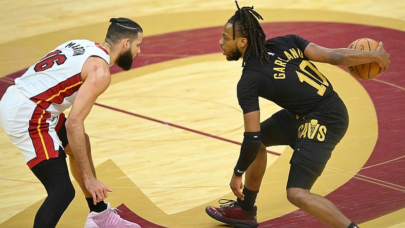 Mar 20, 2024; Cleveland, Ohio, USA; Cleveland Cavaliers guard Darius Garland (10) dribbles beside Miami Heat forward Caleb Martin (16) in the fourth quarter at Rocket Mortgage FieldHouse. Mandatory Credit: David Richard-USA TODAY Sports