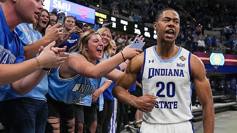 Indiana State Sycamores guard Jayson Kent (20) yells in excitement with fans Wednesday, March 20, 2024, after defeating Southern Methodist Mustangs in the first round of the NIT at the Hulman Center in Terre Haute. The Indiana State Sycamores defeated the Southern Methodist Mustangs, 101-92.
