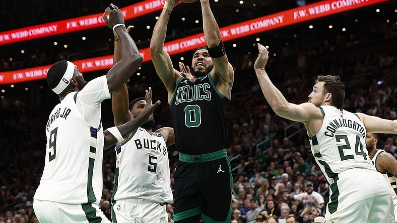 Mar 20, 2024; Boston, Massachusetts, USA; Boston Celtics forward Jayson Tatum (0) goes to the basket between Milwaukee Bucks guard Pat Connaughton (24) and forward Bobby Portis (9) during the second half at TD Garden. Mandatory Credit: Winslow Townson-USA TODAY Sports