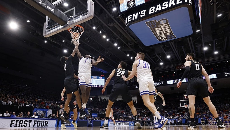 Mar 20, 2024; Dayton, OH, USA; Boise State Broncos forward O'Mar Stanley (1) goes to the basket defended by Colorado Buffaloes forward Cody Williams (10) in the first half at UD Arena. Mandatory Credit: Rick Osentoski-USA TODAY Sports