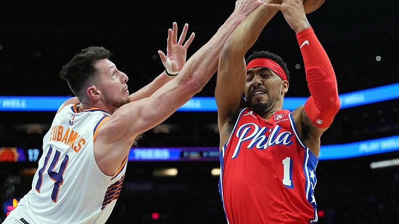Mar 20, 2024; Phoenix, Arizona, USA; Phoenix Suns forward Drew Eubanks (14) guards Philadelphia 76ers forward KJ Martin (1) during the first half at Footprint Center. Mandatory Credit: Joe Camporeale-USA TODAY Sports