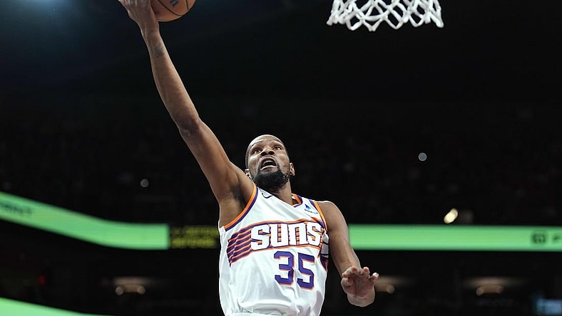 Mar 20, 2024; Phoenix, Arizona, USA; Phoenix Suns forward Kevin Durant (35) makes a layup against the Philadelphia 76ers during the first half at Footprint Center. Mandatory Credit: Joe Camporeale-USA TODAY Sports