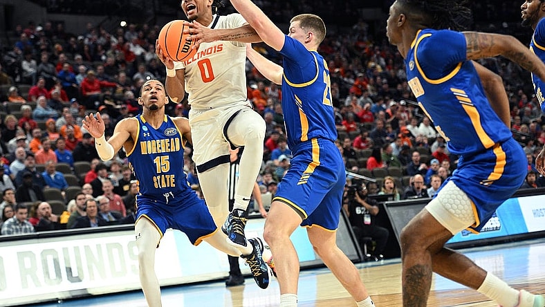 Mar 21, 2024; Omaha, NE, USA; Illinois Fighting Illini guard Terrence Shannon Jr. (0) drives against Morehead State Eagles guard Riley Minix (22) in the first half during the first round of the NCAA Tournament at CHI Health Center Omaha. Mandatory Credit: Steven Branscombe-USA TODAY Sports