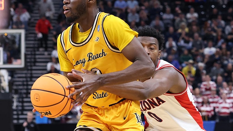 Mar 21, 2024; Salt Lake City, UT, USA; Long Beach State 49ers guard Jadon Jones (12) defended by Arizona Wildcats guard Jaden Bradley (0) during the second half in the first round of the 2024 NCAA Tournament at Vivint Smart Home Arena-Delta Center. Mandatory Credit: Rob Gray-USA TODAY Sports