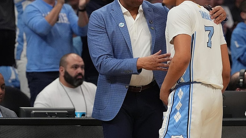 March 21, 2024, Charlotte, NC, USA;  North Carolina Tar Heels head coach Hubert Davis talks with guard Seth Trimble (7) as they play against the Wagner Seahawks in the first round of the 2024 NCAA Tournament at the Spectrum Center. Mandatory Credit: Jim Dedmon-USA TODAY Sports
