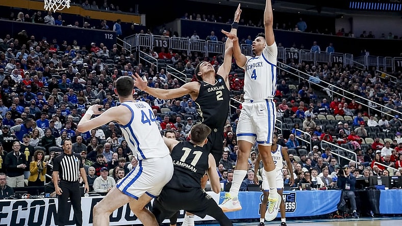 Mar 21, 2024; Pittsburgh, PA, USA; Kentucky Wildcats forward Tre Mitchell (4) jumps to shoot the ball while Oakland Golden Grizzlies forward Chris Conway (2) attempts to block in the first round of the 2024 NCAA Tournament at PPG Paints Arena. Mandatory Credit: Charles LeClaire-USA TODAY Sports