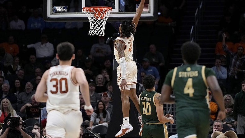 Mar 21, 2024; Charlotte, NC, USA; Texas Longhorns guard Tyrese Hunter (4) puts up a layup in the first half of the first round of the 2024 NCAA Tournament at Spectrum Center. Mandatory Credit: Bob Donnan-USA TODAY Sports