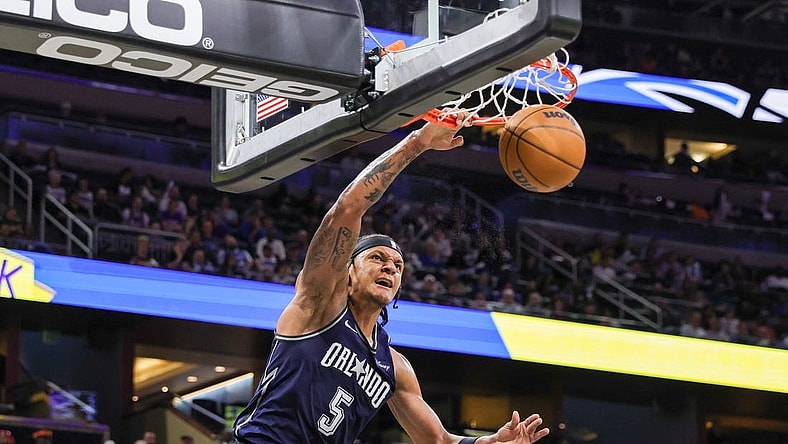 Mar 21, 2024; Orlando, Florida, USA; Orlando Magic forward Paolo Banchero (5) dunks during the second quarter against the New Orleans Pelicans at KIA Center. Mandatory Credit: Mike Watters-USA TODAY Sports