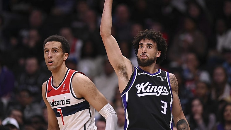 Mar 21, 2024; Washington, District of Columbia, USA;  Sacramento Kings guard Chris Duarte (3) follows through on a three point basket as Washington Wizards forward Patrick Baldwin Jr. (7) looks on during the first half at Capital One Arena. Mandatory Credit: Tommy Gilligan-USA TODAY Sports