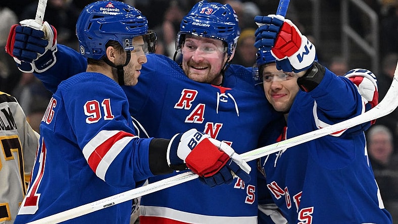 Mar 21, 2024; Boston, Massachusetts, USA; New York Rangers left wing Artemi Panarin (10) celebrates with left wing Alexis Lafreniere (13) and center Alex Wennberg (91) after scoring a goal against the Boston Bruins during the second period at the TD Garden. Mandatory Credit: Brian Fluharty-USA TODAY Sports