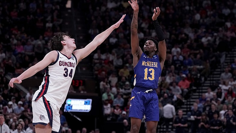 Mar 21, 2024; Salt Lake City, UT, USA; McNeese State Cowboys guard Shahada Wells (13) shoots against Gonzaga Bulldogs forward Braden Huff (34) during the second half in the first round of the 2024 NCAA Tournament at Vivint Smart Home Arena-Delta Center. Mandatory Credit: Gabriel Mayberry-USA TODAY Sports