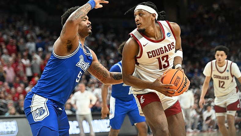 Mar 21, 2024; Omaha, NE, USA; Washington State Cougars guard Isaiah Watts (12) controls the ball against Drake Bulldogs forward Darnell Brodie (51) in the first half in the first round of the 2024 NCAA Tournament at CHI Health Center Omaha. Mandatory Credit: Steven Branscombe-USA TODAY Sports
