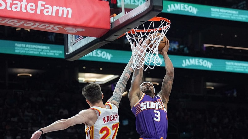 Mar 21, 2024; Phoenix, Arizona, USA; Phoenix Suns guard Bradley Beal (3) dunks over Atlanta Hawks guard Vit Krejci (27) during the first half at Footprint Center. Mandatory Credit: Joe Camporeale-USA TODAY Sports