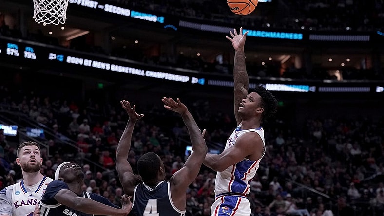 Mar 21, 2024; Salt Lake City, UT, USA; Kansas Jayhawks forward K.J. Adams Jr. (24) shoots against Samford Bulldogs forward Jermaine Marshall (4) during the second half in the first round of the 2024 NCAA Tournament at Vivint Smart Home Arena-Delta Center. Mandatory Credit: Gabriel Mayberry-USA TODAY Sports