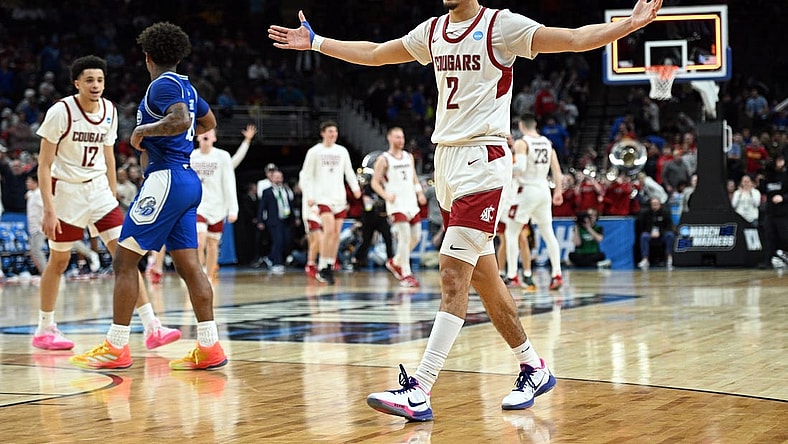 Mar 21, 2024; Omaha, NE, USA; Washington State Cougars guard Myles Rice (2) celebrates after defeating the Drake Bulldogs in the first round of the 2024 NCAA Tournament at CHI Health Center Omaha. Mandatory Credit: Steven Branscombe-USA TODAY Sports