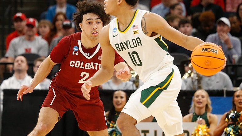Mar 22, 2024; Memphis, TN, USA;  Baylor Bears guard RayJ Dennis (10) dribbles against Colgate Raiders guard Braeden Smith (2) during the second half of the NCAA Tournament First Round at FedExForum. Mandatory Credit: Petre Thomas-USA TODAY Sports