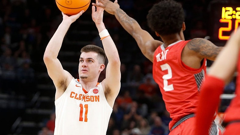 Clemson's Joseph Girard III (11) shoots the ball as New Mexico's Donovan Dent (2) tries to block him during the first round game between Clemson University and University of New Mexico in the 2024 NCAA Tournament at FedExForum in Memphis, Tenn., on Friday, March 22, 2024.